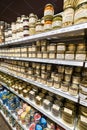 Shelves lined with local products in the historic Gosselin store in Saint-Vaast-la-Hougue in Normandy