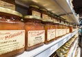 Shelves lined with local products in the historic Gosselin store in Saint-Vaast-la-Hougue in Normandy