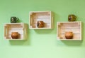 Shelves made of wooden boxes with clay bowls Royalty Free Stock Photo