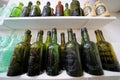 Shelves of old glass bottles Royalty Free Stock Photo