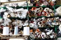 Shelves with rolls of colored fabrics and spools of sewing thread in the foreground Royalty Free Stock Photo