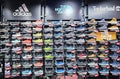 Shelves of sneakers from famous sports manufacturers with discounts on sale