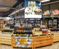 Shelves with various types of sparkling wines with special offers