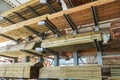 Shelves with wooden boards at building material store