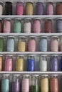Shelving with glass jars of colorful pigments