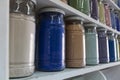 Shelving with glass jars of colorful pigments Royalty Free Stock Photo