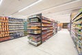 Shelving with products of different nature, variety of food displayed on the shelves