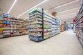 Shelving with products of different nature, variety of food displayed on the shelves