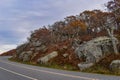 Rocky Facade Along a Mountain Road at the Edge of a Forest Revealing Colorful Fall Foliage Royalty Free Stock Photo