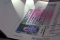 Shengen visa stamp in international passport. Schengen document for pass customs control on border of a country. Document for trav