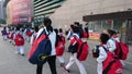 Shenzhen, China: children athletes walk past the sports square to take part in a competition