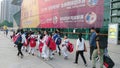 Shenzhen, China: children athletes walk past the sports square to take part in a competition