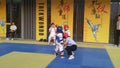 Shenzhen, China: children practicing taekwondo compete to test the effectiveness of their taekwondo lessons