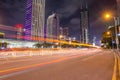 Shenzhen, China city street with light trail at twilight