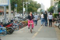 Shenzhen, China: cycling women on the streets
