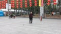 Shenzhen, China: elderly people play top as a fitness exercise in the morning sports square