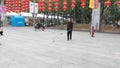 Shenzhen, China: elderly people play top as a fitness exercise in the morning sports square