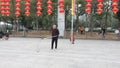 Shenzhen, China: elderly people play top as a fitness exercise in the morning sports square