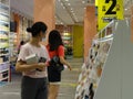 Shenzhen, China: Female shoppers shop for a 20 percent discount at a shopping mall