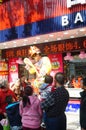 Shenzhen, China: Gold jewelry store promotions, clown performances