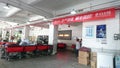 Shenzhen, China: an interior view of the sf express business office as workers pack items for shipment