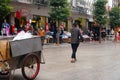 Shenzhen, China: a man with a mental illness picks up food from a dustbin