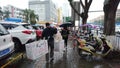 Shenzhen, China: men carry the burden, walk the streets, walk through the lanes and sell Wuda cooking cakes