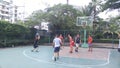 Shenzhen, China: men play basketball as a recreational sport.