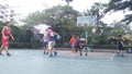 Shenzhen, China: men play basketball as a recreational sport.