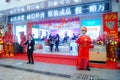 Shenzhen, China: mobile phone stores opened, Sun Wukong and young women dancing to attract customers