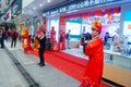 Shenzhen, China: mobile phone stores opened, Sun Wukong and young women dancing to attract customers