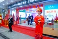 Shenzhen, China: mobile phone stores opened, Sun Wukong and young women dancing to attract customers