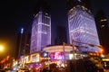 Shenzhen, China: night view of downtown bao `an, street and high-rise buildings and neon lights