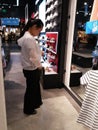 Shenzhen, China: people buy clothes or shoes at anta sports apparel store