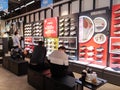Shenzhen, China: people buy clothes or shoes at anta sports apparel store