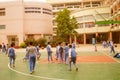 Shenzhen, China: pupils play basketball on the basketball court