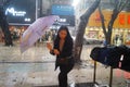 Shenzhen, China: rain, umbrella girls
