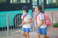 Shenzhen, China: after school in the afternoon, some students take their parents` electric bikes home, while others walk on their Royalty Free Stock Photo