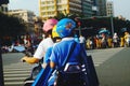 Shenzhen, China: after school in the afternoon, some students take their parents` electric bikes home, while others walk on their Royalty Free Stock Photo