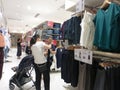 Shenzhen, China: shoppers shop for clothes at uniqlo`s clothing store at night Royalty Free Stock Photo