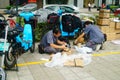 Shenzhen, China: on the sidewalk courier company employees are distributing customer courier