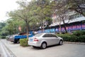 Shenzhen, China: sidewalks and green belt park vehicles