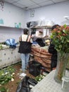 Shenzhen, China: The staff of an online fresh flower shop is binding flowers according to the order