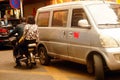 Shenzhen, China: street electric vehicles carrying women