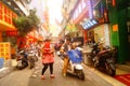 Shenzhen, China: street electric vehicles carrying women