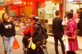 Shenzhen, China: street electric vehicles carrying women
