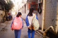 Shenzhen, China: two primary school girls go home on their way home from school