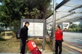 Shenzhen, china: volunteers help visitors