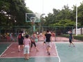 Shenzhen, China: weekend, office workers are playing basketball fitness