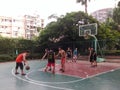 Shenzhen, China: weekend, office workers are playing basketball fitness